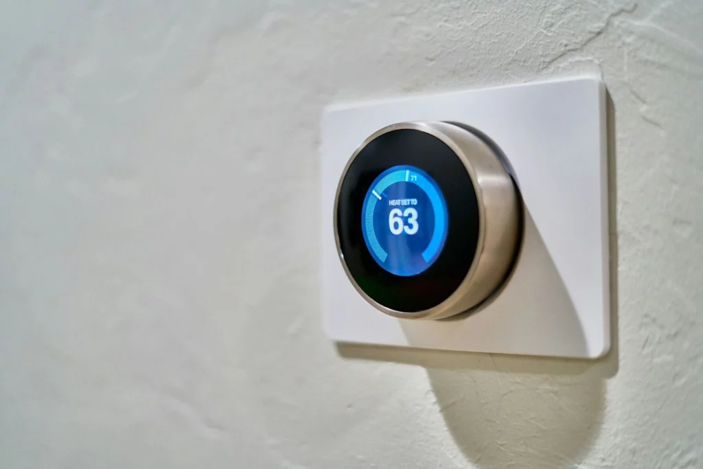 A smart thermostat on a wall in a Chester County home