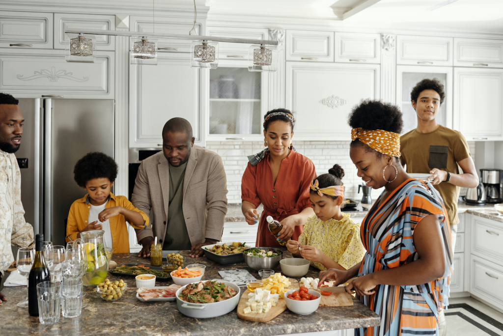 A family spending time together in their kitchen kept comfortable with proper routine HVAC maintenance