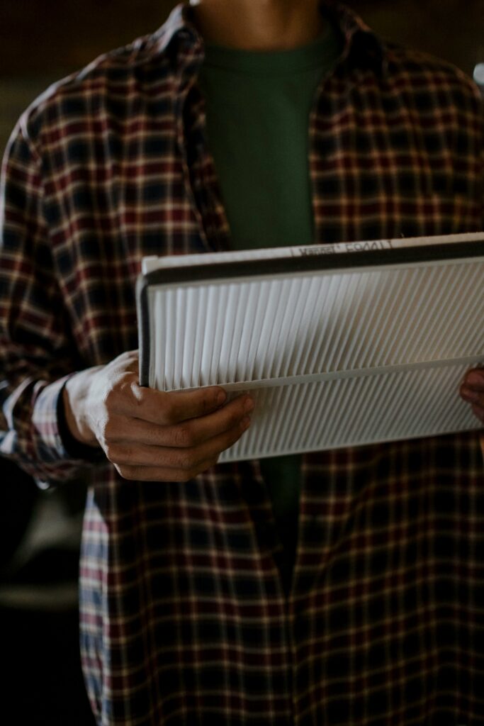 A Kennett Square homeowner holding a new HVAC air filter