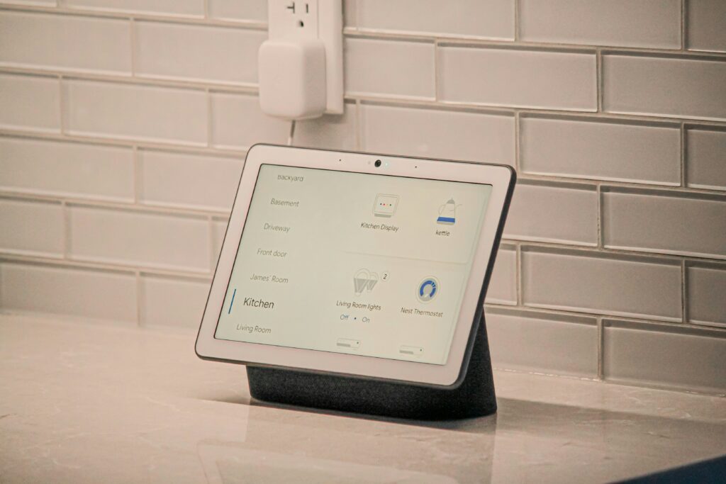 A touch screen that controls an integrated smart home system including a smart thermostat