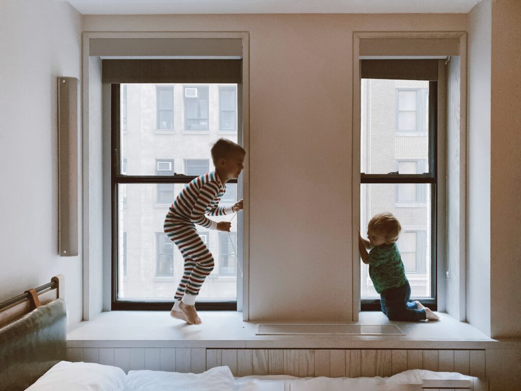 two young brothers playing in their bedroom and breathing healthy clean air