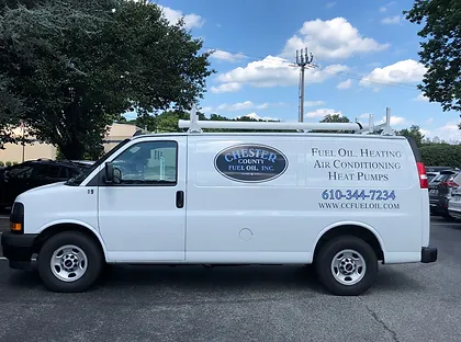 A Chester County Fuel Oil HVAC repair van parked outside of a Downingtown, PA home